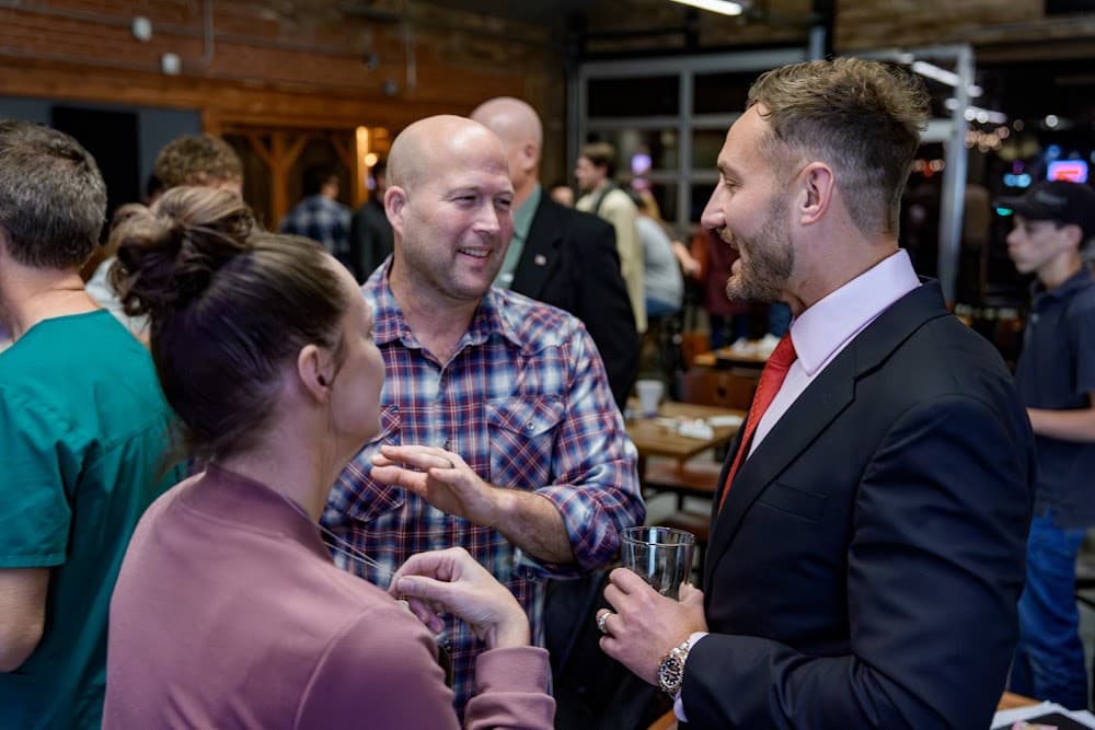 Two people in conversation at the competition