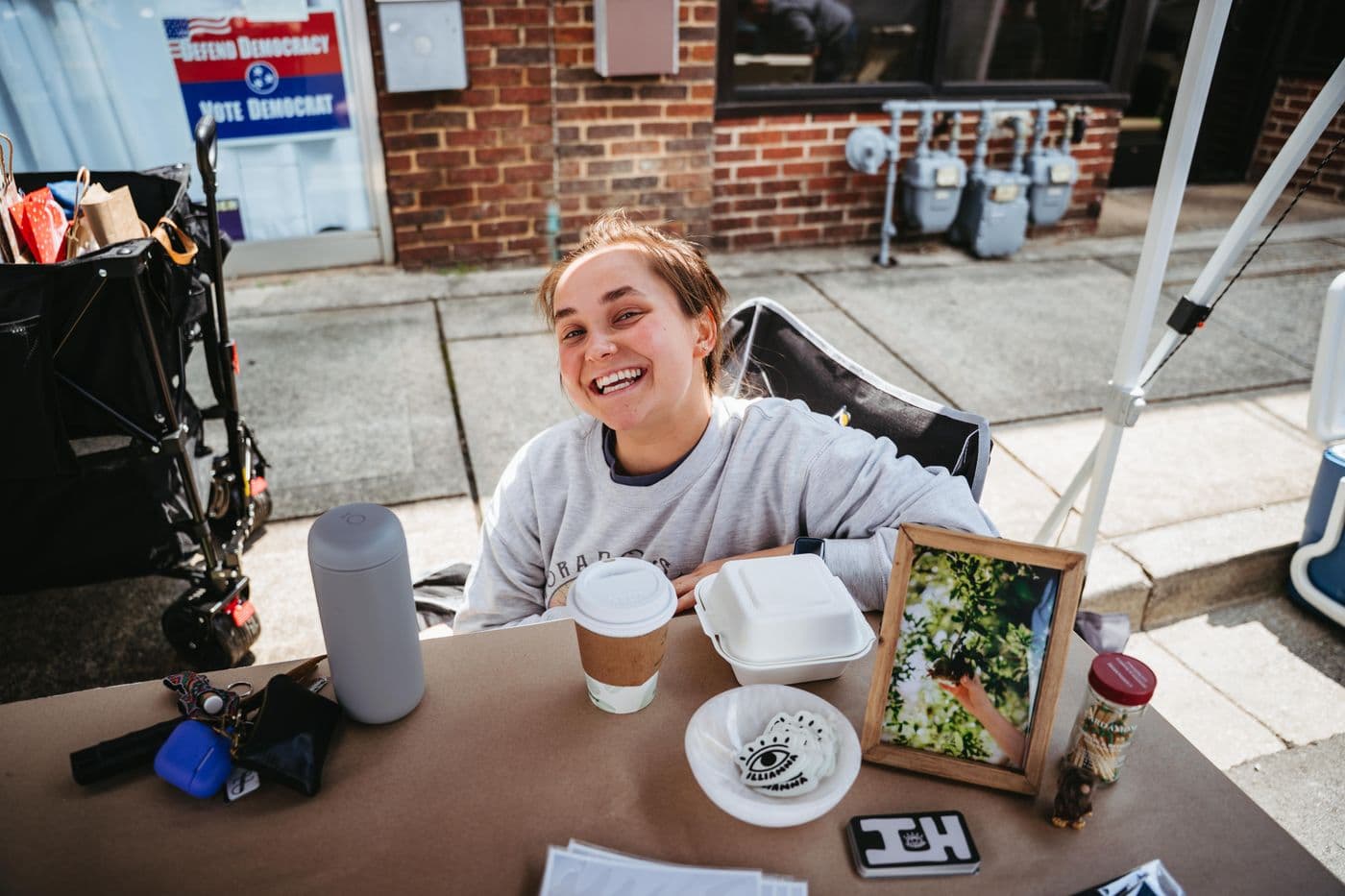 A maker behind her table at the market