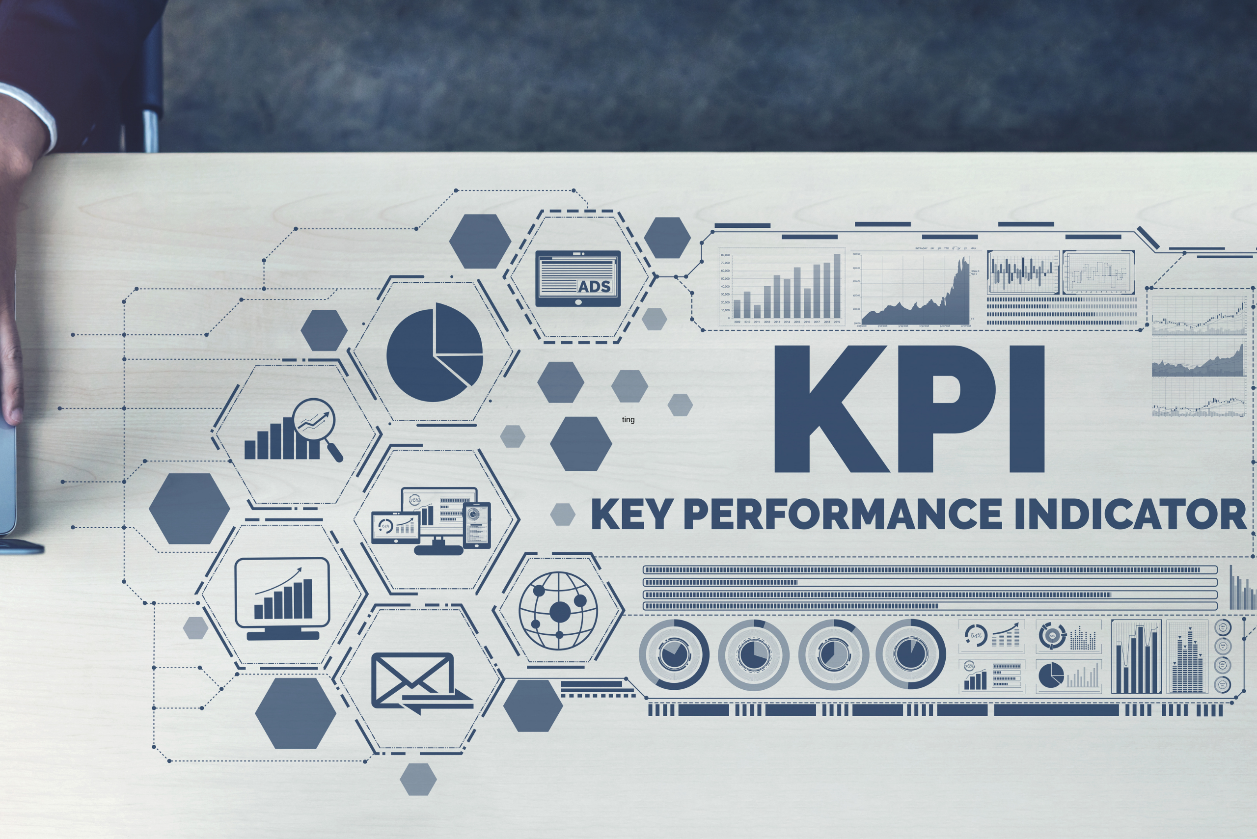 image of desk with key performance indicator graphic