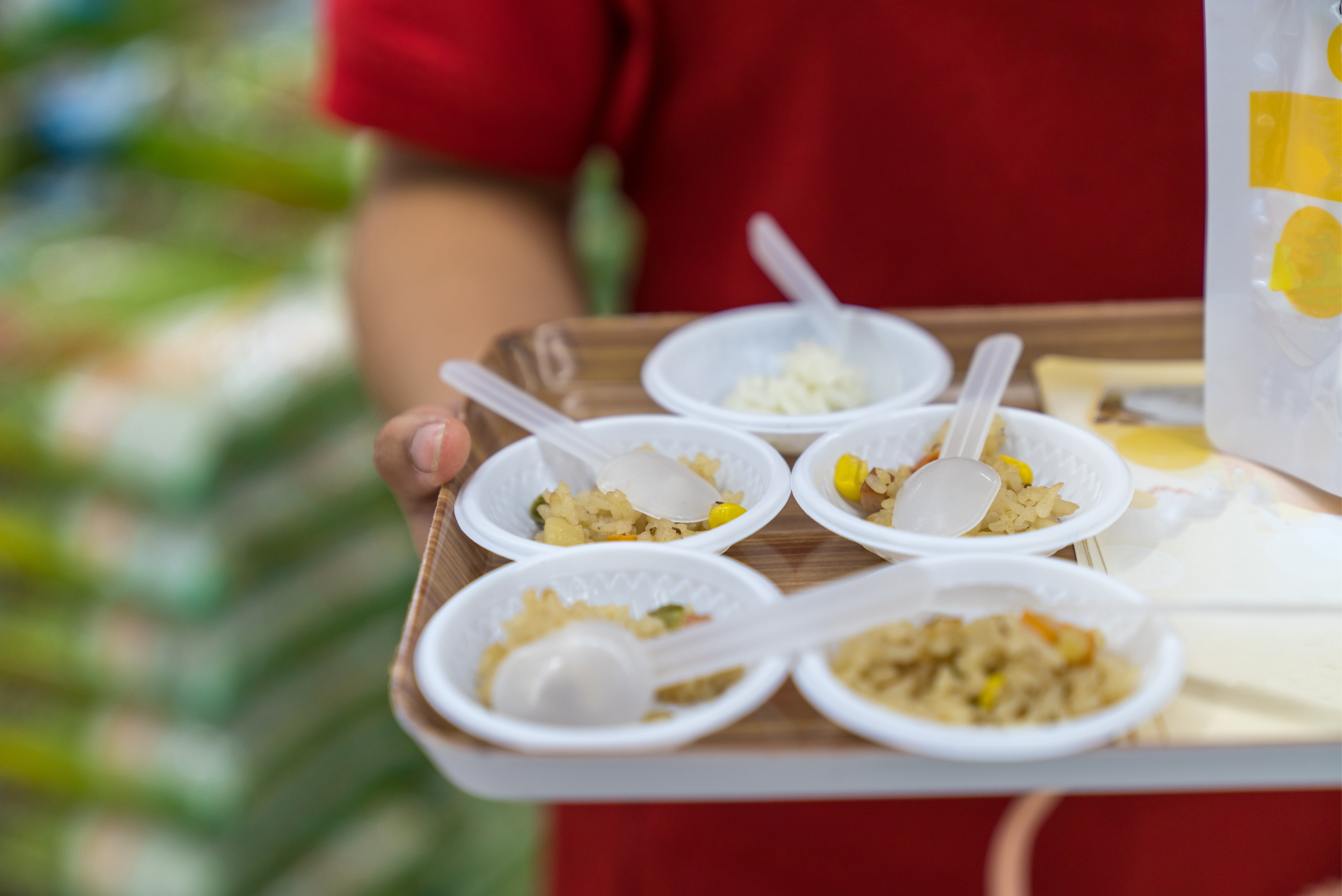 man serving free food samples