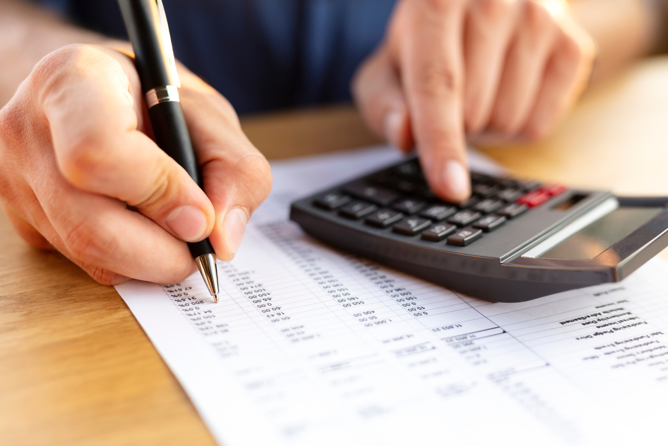 Photo of man working on Profit and Loss Statement