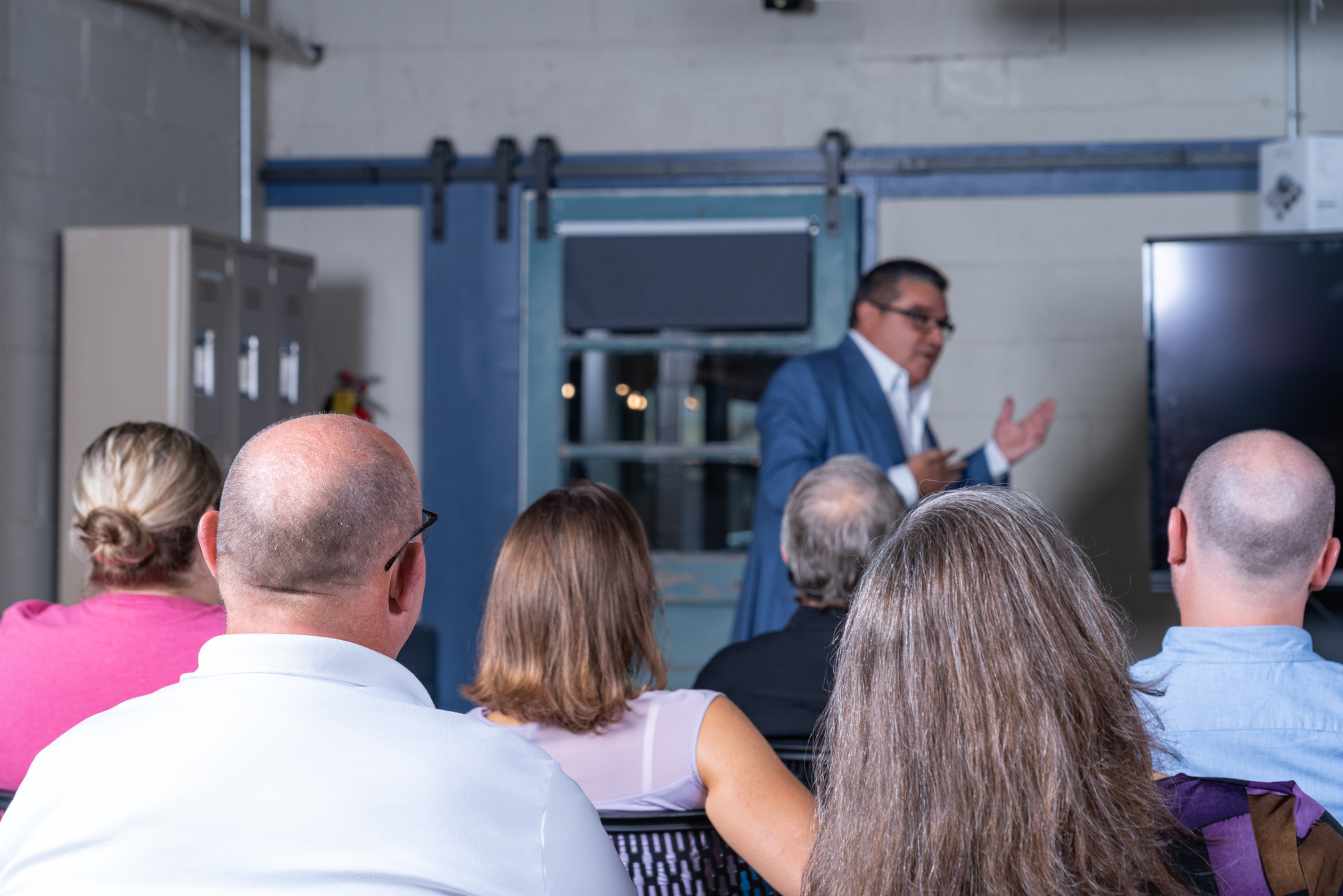 Man doing a business pitch in front of an audience