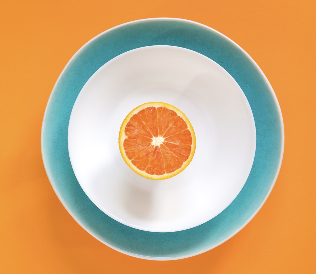 Example of near complementary color scheme with orange and a light turquoise being softened with white.